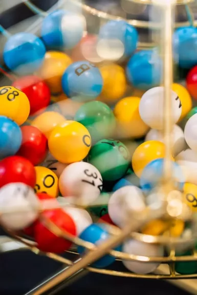 Colorful lottery balls in a spinning cage.